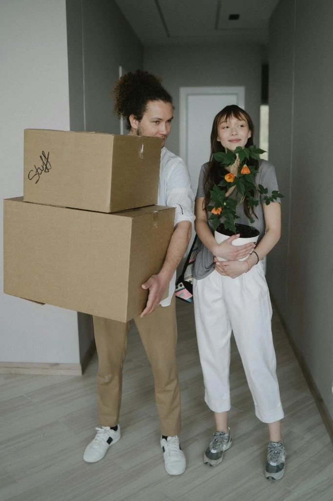 Couple settling into their new home with moving boxes